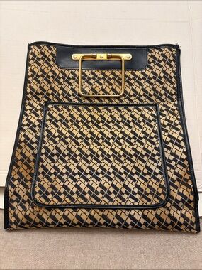 authentic vintage 1970s Saks Fifth Avenue Monogram Sac Plat handbag.